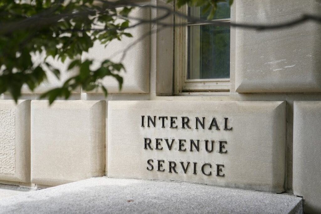 Internal Revenue Service IRS headquarters building with trees in front.